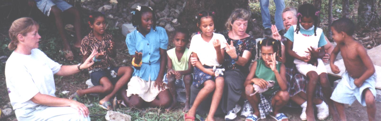Learning to count in English. Missionary Becky Hostetter is seated far left.