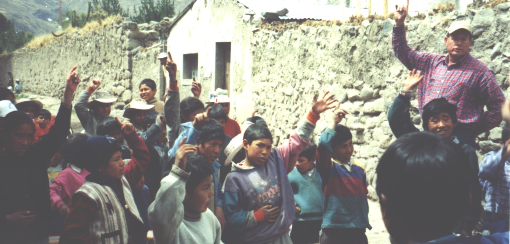This is why we traveled so far into the Andes Mountains. These children are accepting Jesus Christ as their Savior. Pictured upper far right is Missionary to Peru Charlie Steffler.